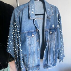 Denim jacket with pearl embellished sleeves